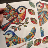 Colorful patchwork birds wall decals made from eco-friendly fabric, perfect for playful home decor in any room.