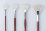 Premium hog bristle filbert brush with long red handle, ideal for oils and acrylics, perfect for detail and bold strokes.