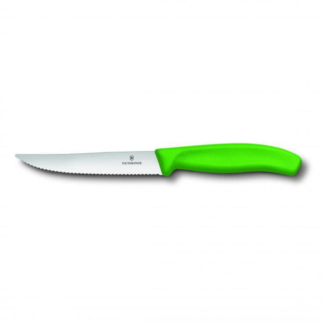 Vibrant green Victorinox steak pizza knife with wide wavy blade, designed for effortless cutting of meats and pizzas.