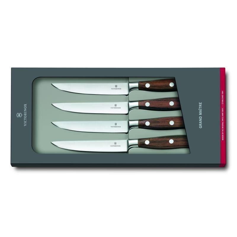 Victorinox Grand Maître 4-piece steak knife set with rosewood handles and precision blades for effortless meat slicing.