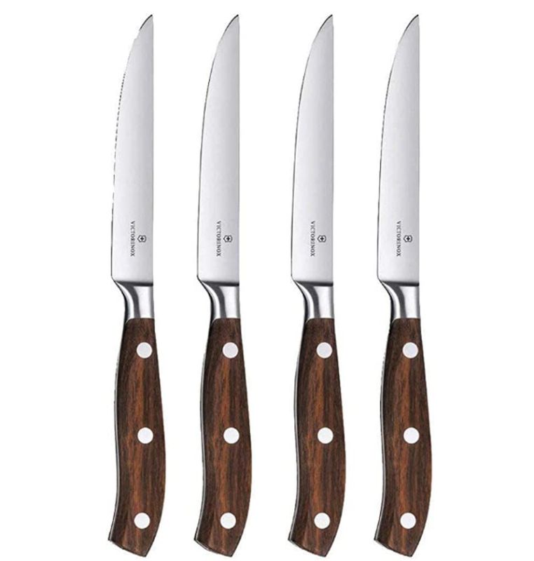 Victorinox Grand Maître 4-piece steak knife set with elegant rosewood handles and perfectly balanced, sharp blades for effortless slicing.