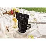 PackIt Freezable Napa Wine Bag in Black Grid, designed to chill wine for outdoor events with a buckle handle for easy transport.
