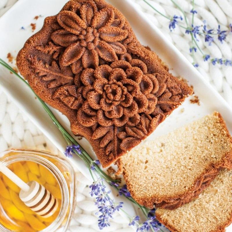 Nordic Ware Wildflower Loaf Pan in Toffee, featuring intricate floral designs and 6-cup capacity for perfect baking results.