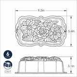 Nordic Ware Wildflower Loaf Pan in Toffee features intricate floral designs, 6-cup capacity, and durable cast aluminum for even baking.