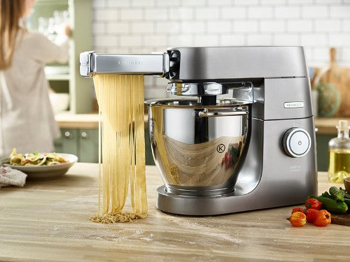 Stainless steel Kenwood trenette pasta cutter attachment with integral side rings for easy cleaning.