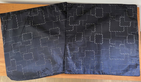 Luxurious black cushion covers with golden cube design, perfect for stylish home decor; set of 4 for clearance price.