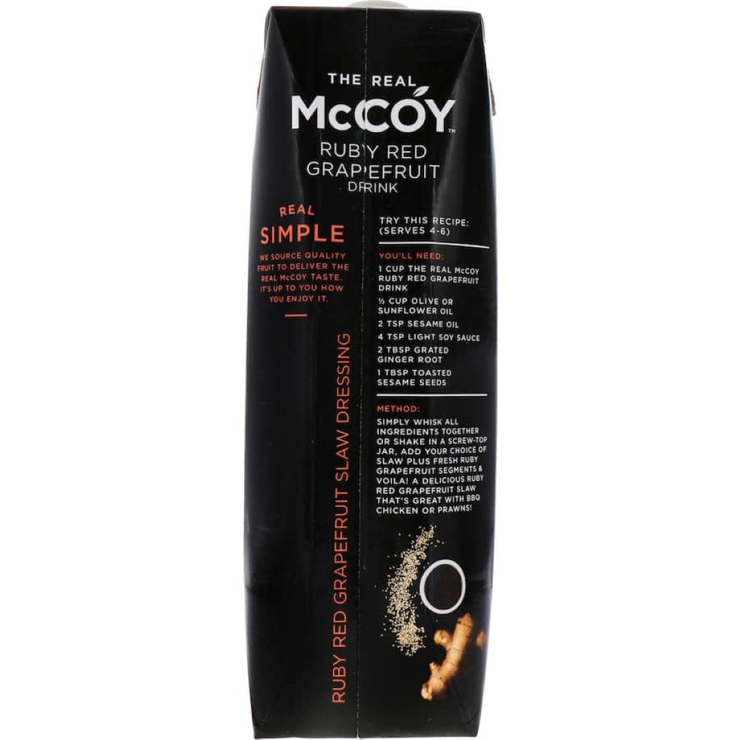 McCoy Fruit Drink Ruby Red Grapefruit in a glass, showcasing its vibrant color and refreshing appeal.