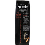 McCoy Fruit Drink Ruby Red Grapefruit in a glass, showcasing its vibrant color and refreshing appeal.