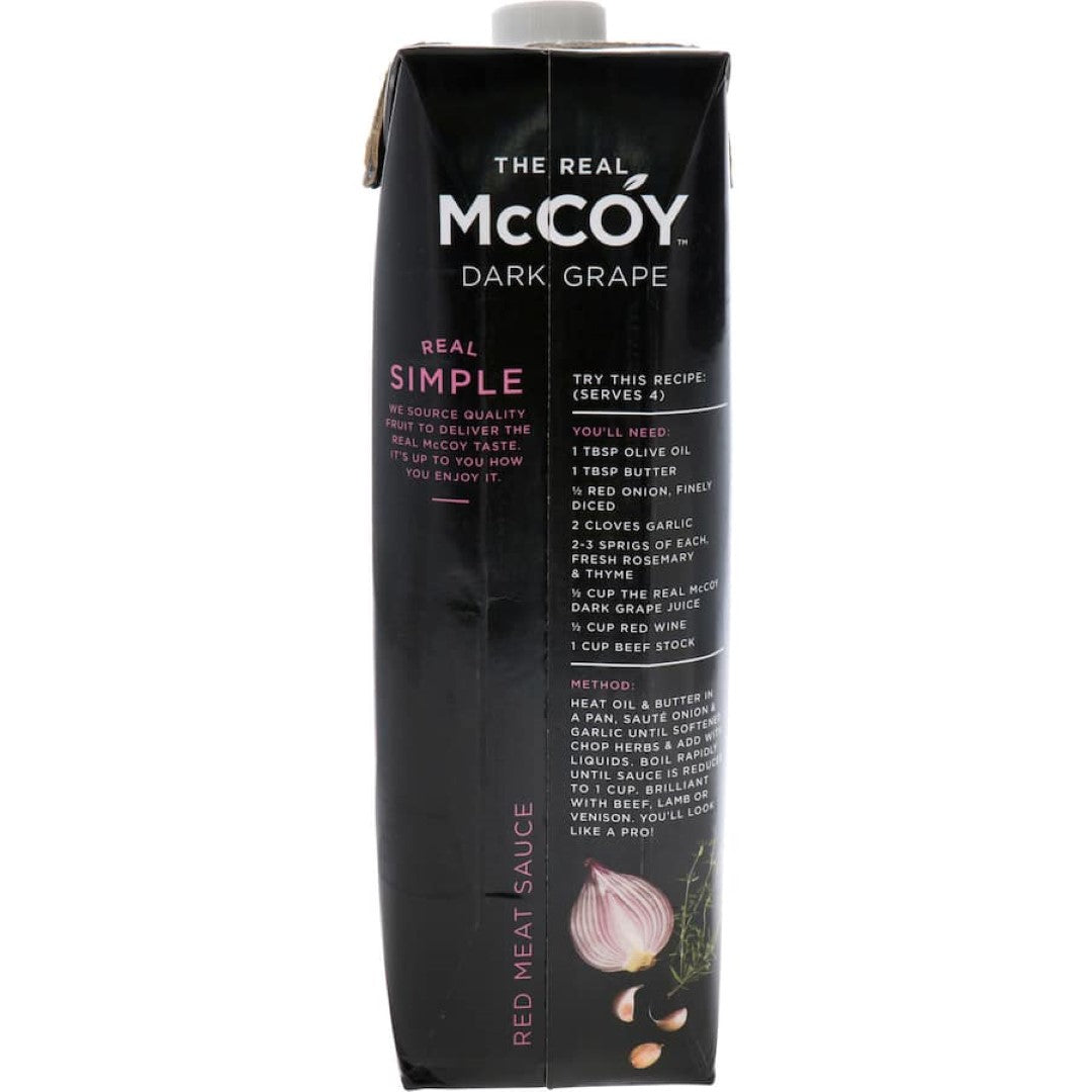 A bottle of Mccoy Fruit Juice Dark Grape showcasing rich natural grape flavor, free from artificial additives and preservatives.