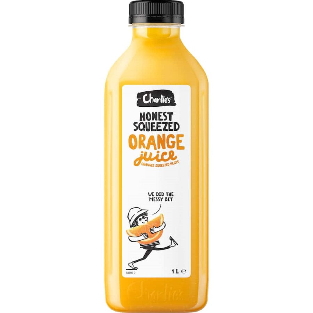 A bottle of Charlie's Fruit Juice Orange, showcasing 100% pure, fresh-squeezed orange juice with vibrant flavor.