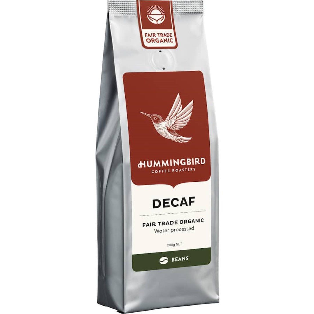 Freshly roasted decaf whole beans coffee from Hummingbird; rich flavor with chocolate notes in a 200g recyclable bag.