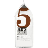 A pack of Jed's Whole Beans Coffee #5 Extra Strong, showcasing bold flavors and ideal for various brewing methods.