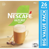 Nescafe Hazelnut Coffee Sachets 26 Pack, rich coffee flavor with roasted hazelnuts, perfect for a quick creamy latte at home.