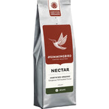 Medium roast organic whole coffee beans with nutty flavors, ethically sourced and hand-blended in New Zealand.