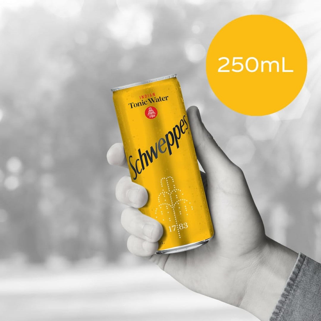 A bottle of Schweppes Indian Tonic Water, ideal for cocktails, featuring crisp effervescence and natural quinine for a refreshing taste.