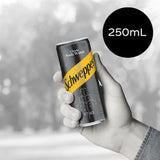 Schweppes soda water in a sleek bottle, offering crisp refreshment and perfect for mixing or enjoying with lemon.