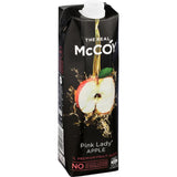 Bottle of McCoy Fruit Juice Pink Lady Apple showcasing natural sweetness and vibrant color, free from artificial additives.