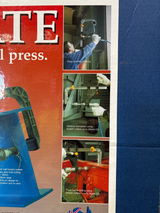 Portable hand-held drill press with 43mm collar for stable, precise drilling in wood, metal, or plastic; includes attachments.