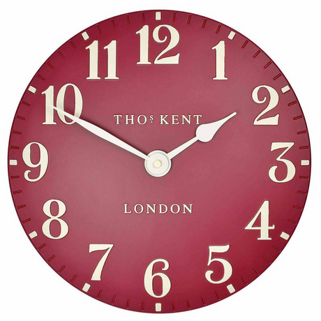 Deep red Arabic wall clock with embossed numerals, spade hour hand, and sleek minute hand, perfect for any home decor.