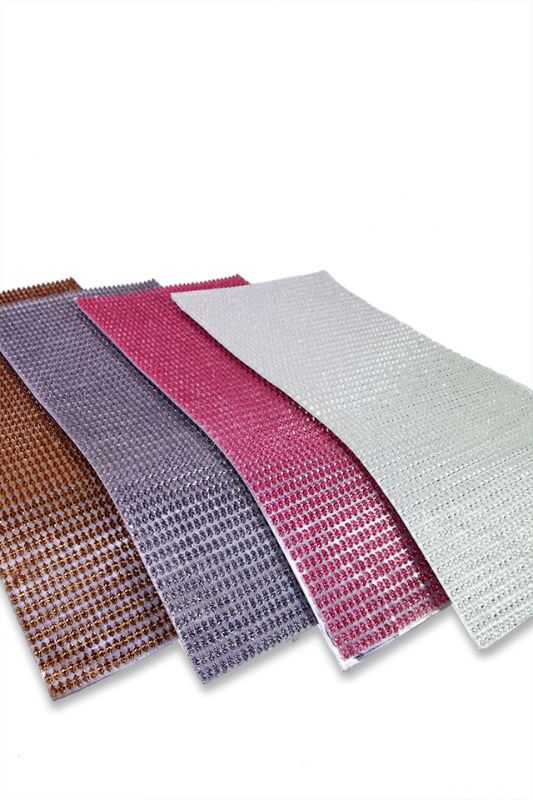 Eye-catching silver resin triangles, perfect for DIY crafts and decorations, measuring 10mm x 5mm on a 205mm x 495mm sheet.