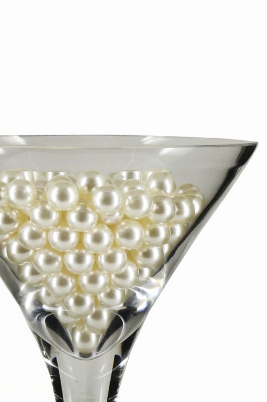 White Pearl Scatters (235pc) enhance decor with a luxurious shine, ideal for table centerpieces and festive events.