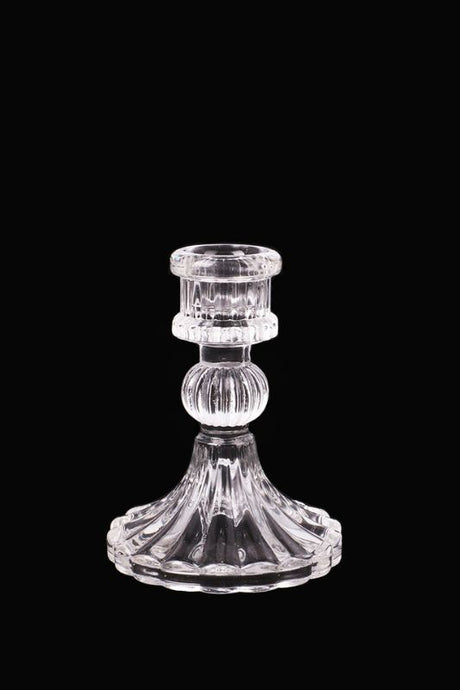 Set of 6 clear fluted glass candle holders, elegantly crafted for tea lights and votives, ideal for any decor style.