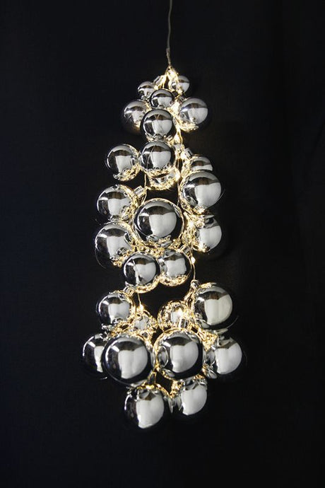 28 silver LED cascading baubles with warm white lights, ideal for festive tree or window displays, measuring 32 x 3/4/5cm.