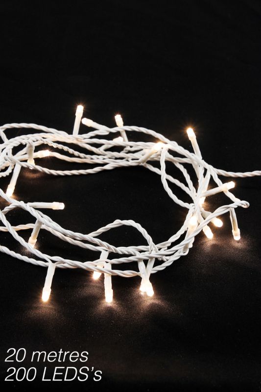 Warm white LED string lights on a white cable, perfect for creating a cozy ambiance for events and celebrations.