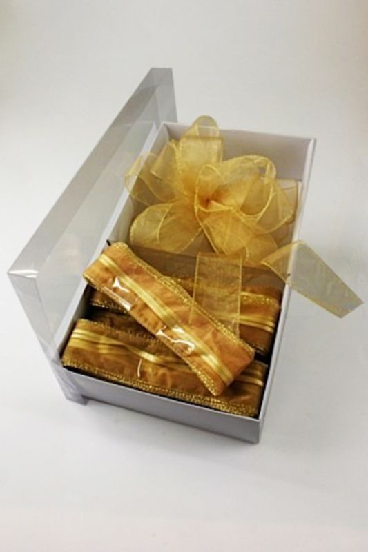 Elegant old gold ribbon with a gold edge, perfect for quick bows and enhancing gift packaging or crafts.