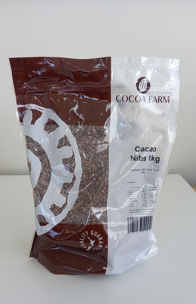 Premium 1kg packet of organic cacao nibs, perfect for adding rich, chocolatey flavor to smoothies and desserts.