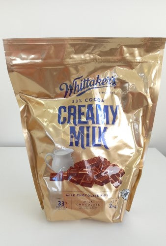 Whittaker's 2kg Chocolate Creamy Milk Pips, rich and velvety chocolate treats perfect for snacking or baking.