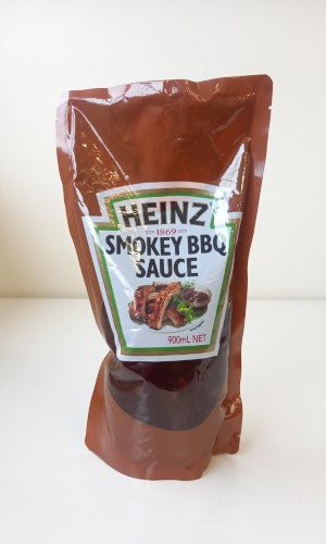 Smokey BBQ Sauce by Heinz in a 900g packet, perfect for adding rich flavor to grilled dishes.