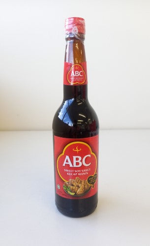 Bottle of Kecap Manis Abc sweet soy sauce, 620ml, ideal for marinating and drizzling for authentic Indonesian flavor.