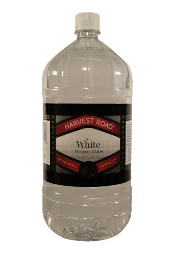 Harvest Road White Vinegar in a 2-liter bottle, perfect for cooking, cleaning, and enhancing flavors in recipes.