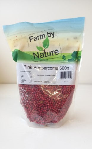 Whole pink peppercorns in a 500gm packet, adding flavor and health benefits to culinary dishes.