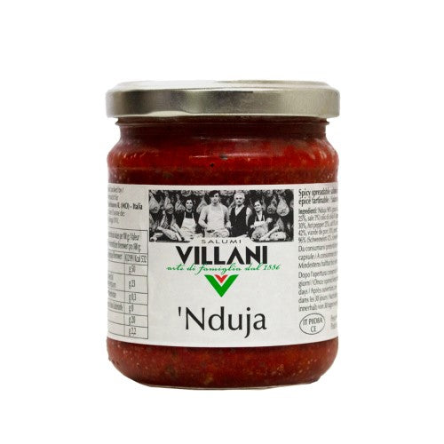 A jar of Villani Nduja, a spicy spreadable salami perfect for gourmet cooking, pasta, and dips.