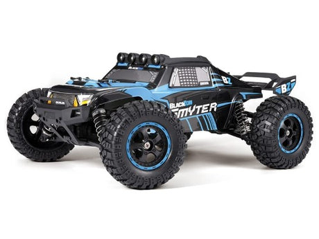 Alt text: RC 1/12 Smyter 4WD monster truck in electric blue with adjustable shocks and splashproof electronics for all-terrain fun.