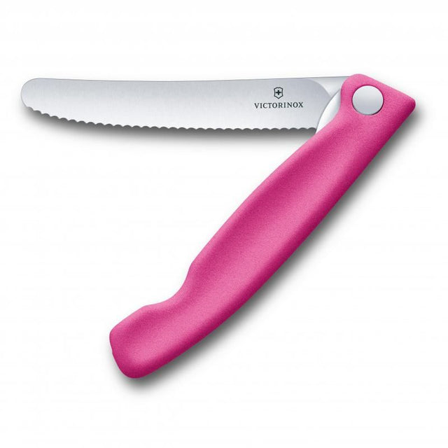 Victorinox Classic Foldable Paring Knife in pink, featuring a stainless steel wavy blade for versatile peeling and chopping.