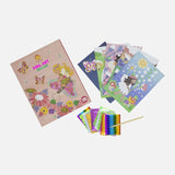 Colorful foil art kit featuring enchanting fairy designs, butterflies, and flowers for creative fun and sparkling masterpieces.