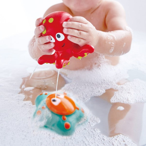 Colorful octopus and starfish bath toys by Hape, designed for sensory play and water fun for toddlers aged 12 months and up.