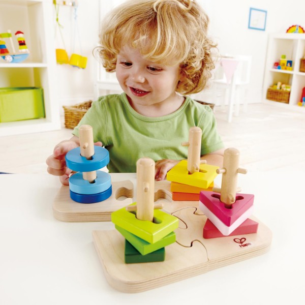 Colorful Hape peg puzzle for toddlers, enhancing problem-solving and fine motor skills with grooved shapes and pegged posts.