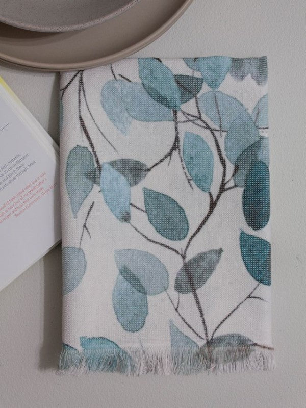 Blue leaves printed kitchen towel by BAKSANA, made of 100% cotton, with terry reverse and loop tag for easy hanging.