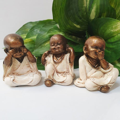 White ceramic ornament featuring three wise monks symbolizing see no evil, hear no evil, speak no evil, standing 10cm tall.