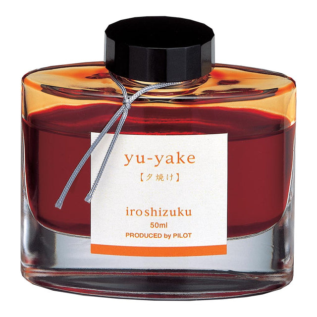 Pilot Iroshizuku ink in 50ml glass bottle, rich Sunset Yu-yake color inspired by Japanese sunsets, ideal for artists and writers.