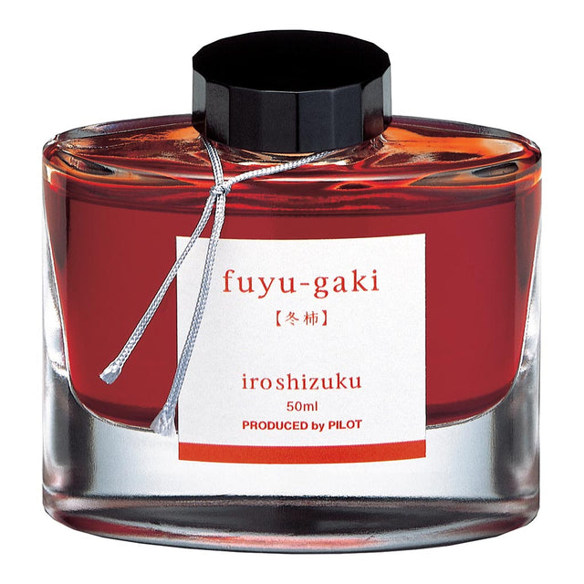 Pilot Iroshizuku Winter Persimmon ink in a 50ml glass bottle, showcasing a warm, rich hue ideal for writing and art.