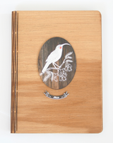 Elegant dark wood bamboo notebook featuring a tribal husky design, perfect for journaling and gifting.