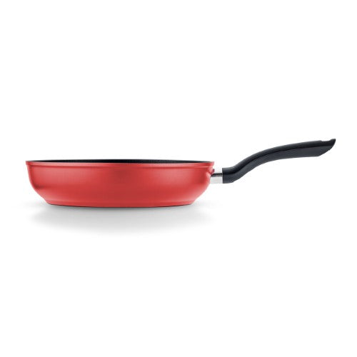 Two red Fissler frying pans (24cm and 28cm) with nonstick coating, ergonomic handles, and high rims for comfortable cooking.