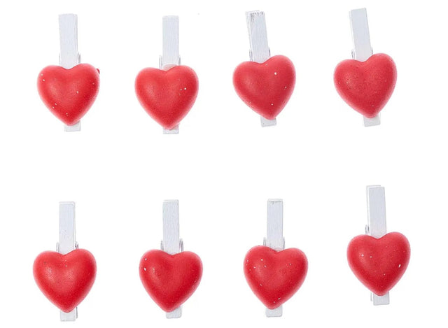 Vibrant red heart-shaped wooden pegs, 24mm wide with 45mm spring-loaded clips, perfect for crafts and decorations.