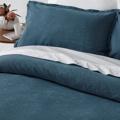 Stonewashed jacquard California King duvet cover set in mid blue, includes two matching Oxford pillowcases, made from OEKO-TEX cotton.