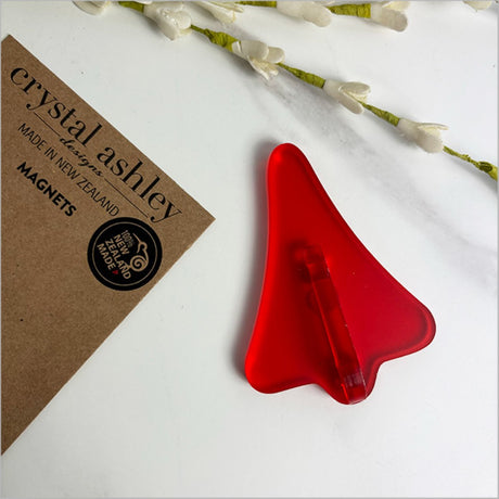 Red satin acrylic magnet shaped like a jet plane, inspired by Kiwi sweets, perfect for holding notes and adding decor.